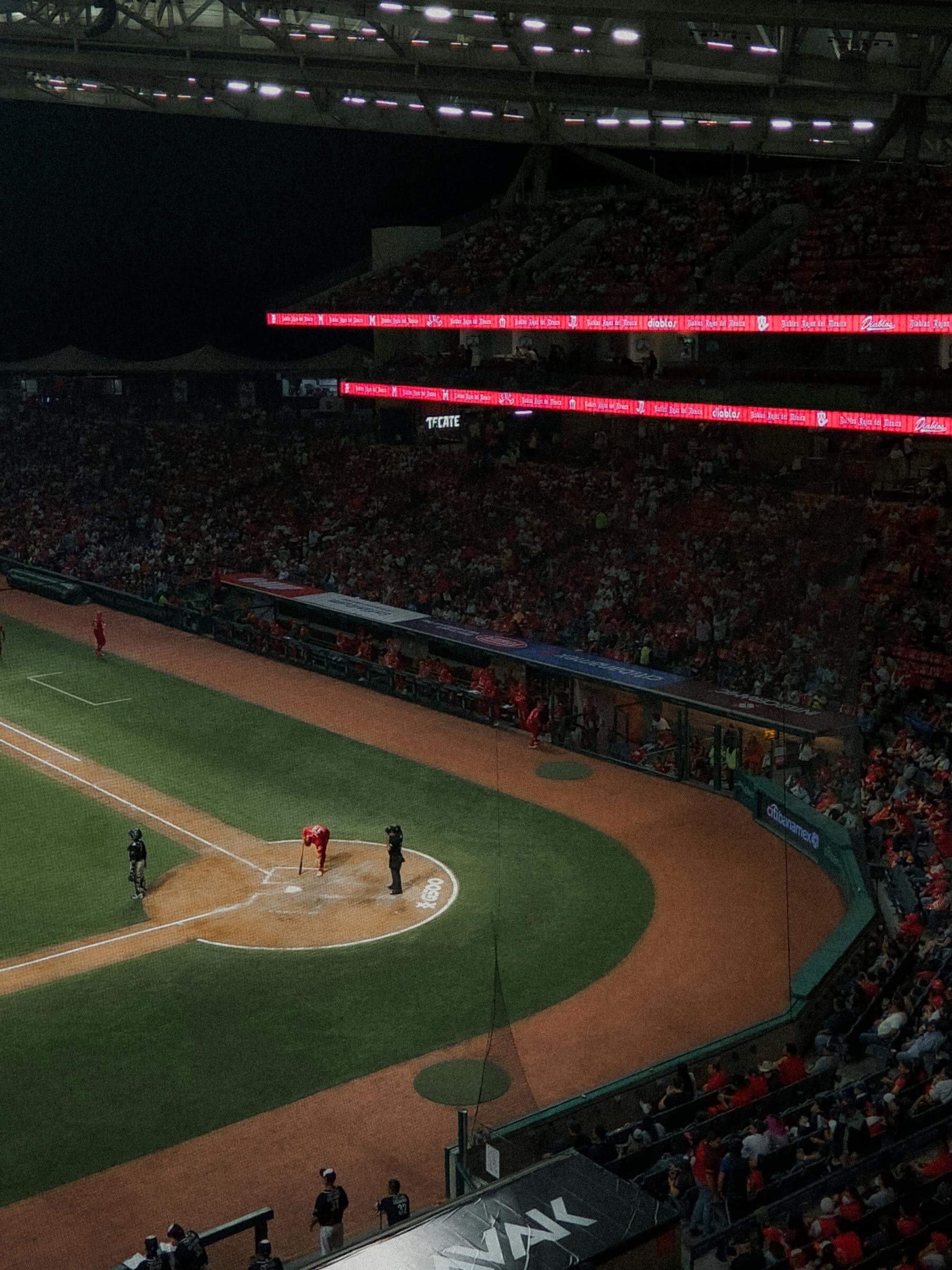 Football stadium crowd under lights